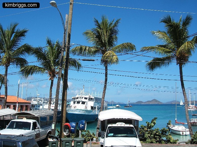 Cruz Bay harbor dock with ferry boat.