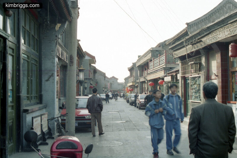 Chinese street lined with small shops.