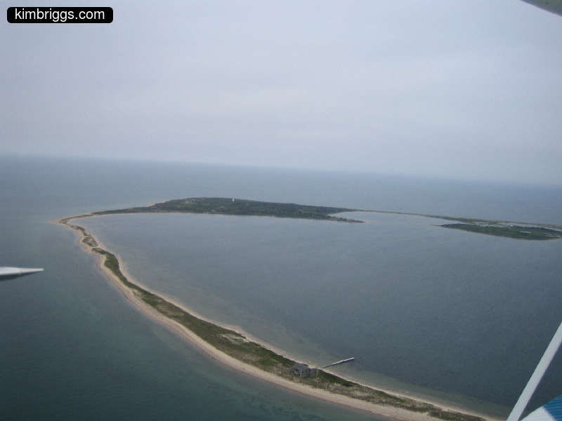 Aerial view of skinny peninsula beach.