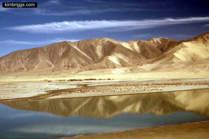 Desert mountain reflection in a river.