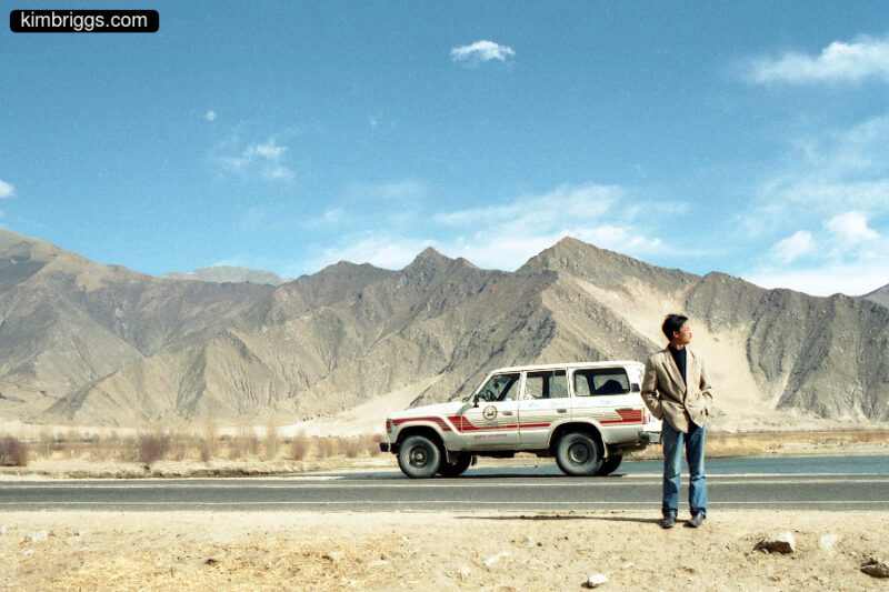 Tibetan touring SUV and driver.