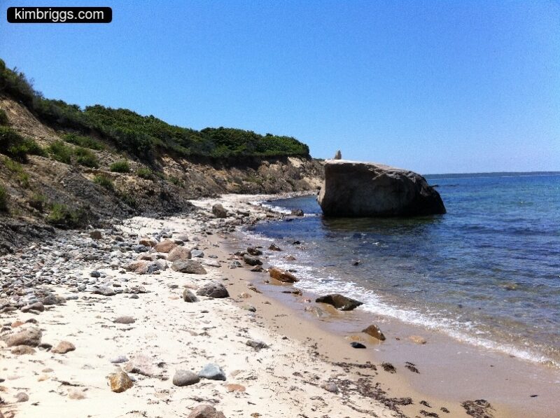 Rocky shoreline and sandy hill