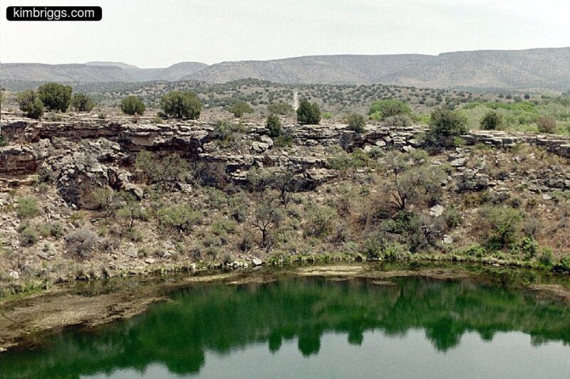 Montezuma's Well with desert background.