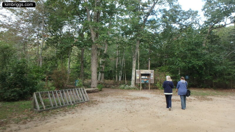 Two women at a trailhead.