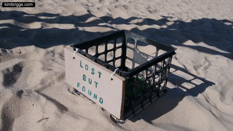 Lost and Found bucket on beach.