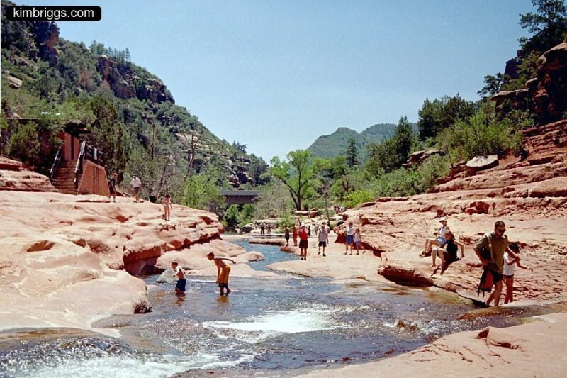 People in Slide Rock Park river.