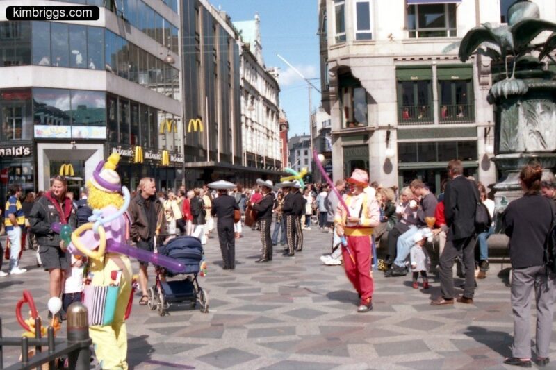 Clowns and Mariachi Band in city center.