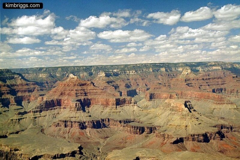 Multicolored layers in expansive Grand Canyon cliffs.