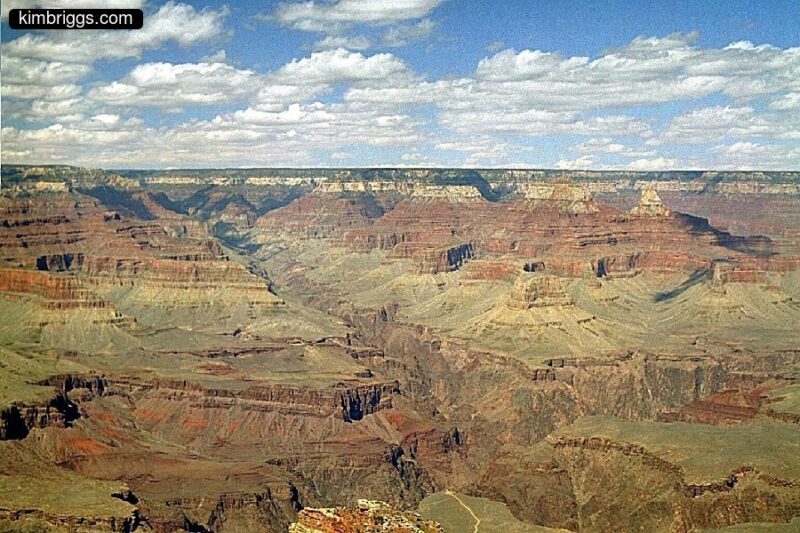 Grand Canyon expansive view with blue sky.