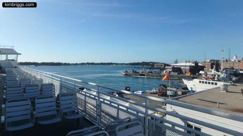 View of ferry boat seats and harbor.