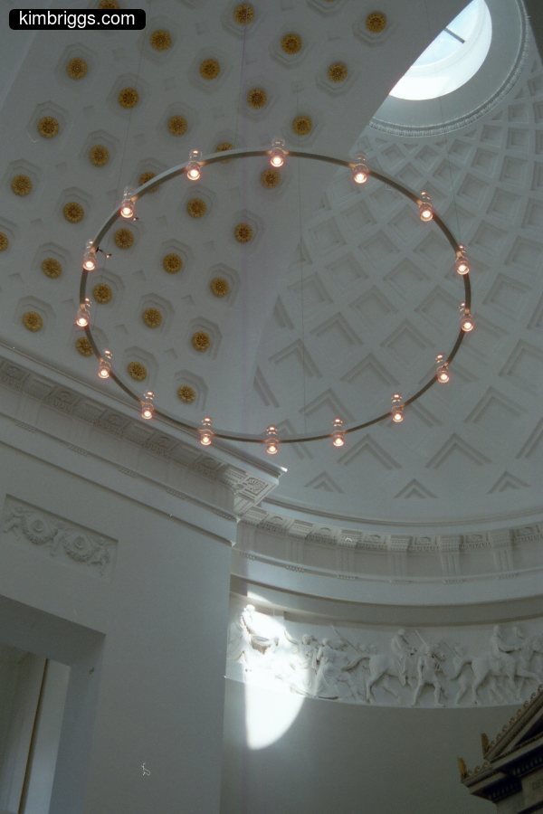 Circular light array in white dome building.