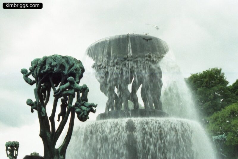 Huge water fountain with Vigeland people holding up water tray.
