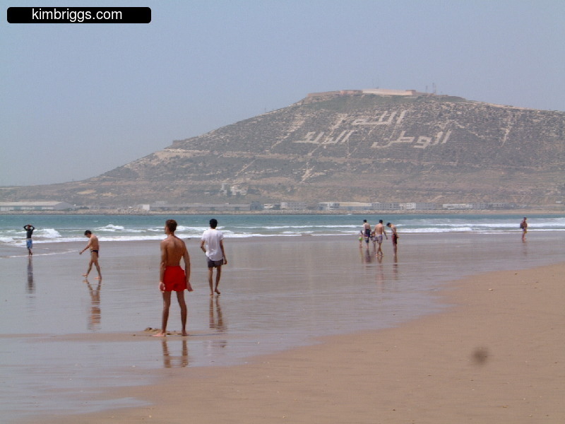 View of Agadir beach and hill in background.