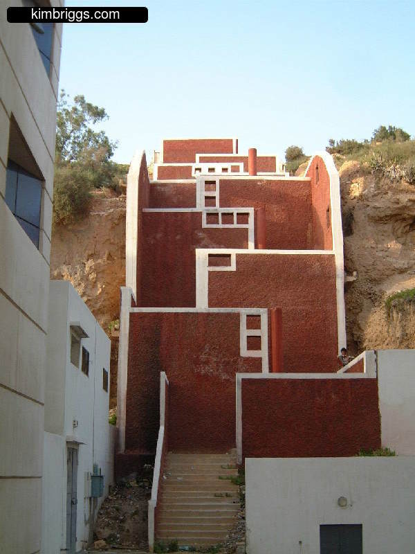 Red masonry walls with white trim.