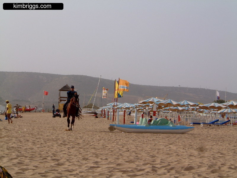 Police officer on a horse on Agadir Beach.