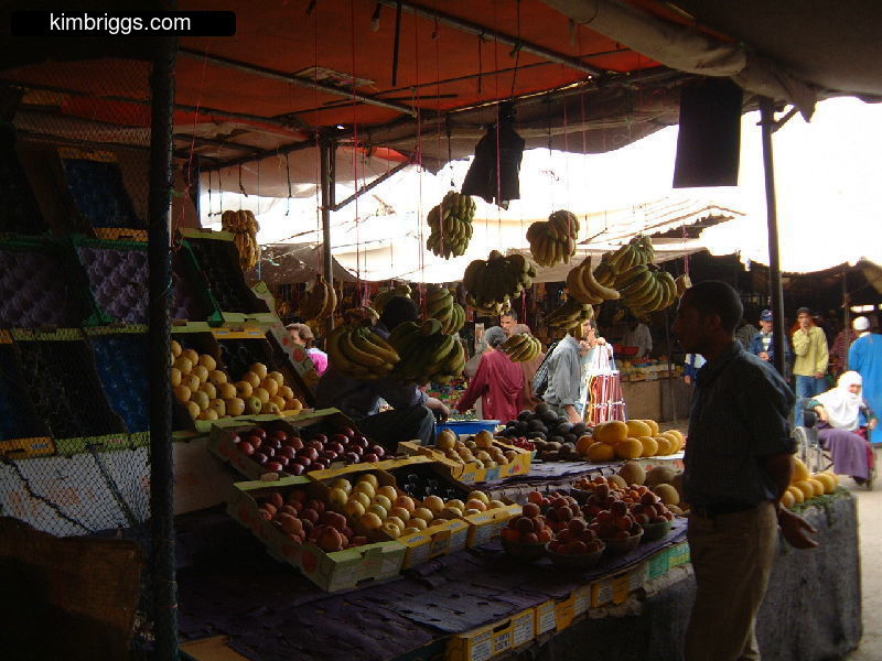 Man selling fruit in open-air market