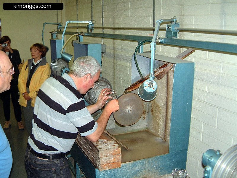 Man carving glass crystal.