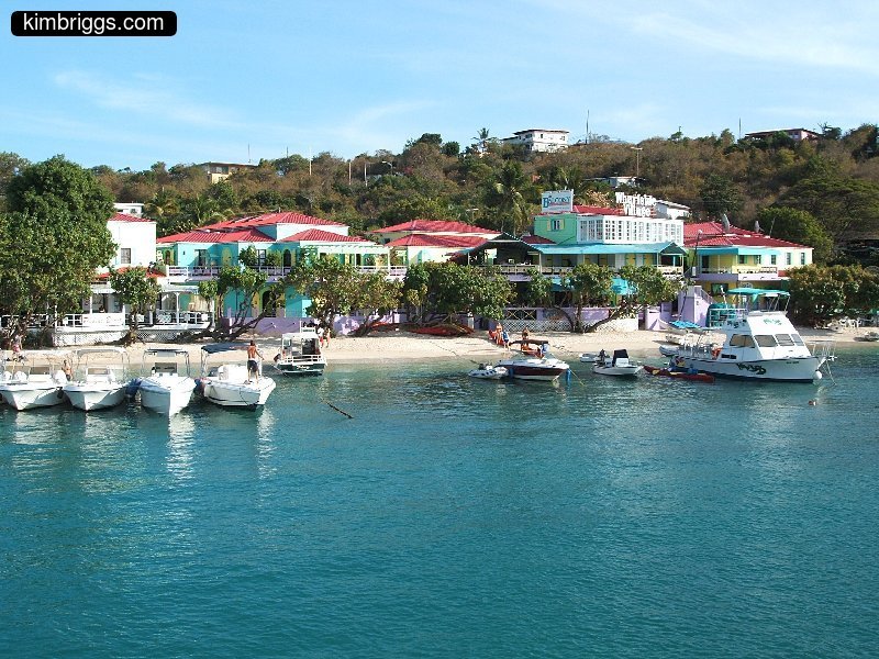 Colorful shops and bars on Cruz Bay beach.