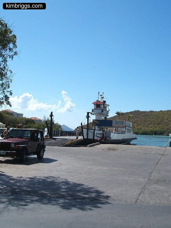 Small ferry at dock.