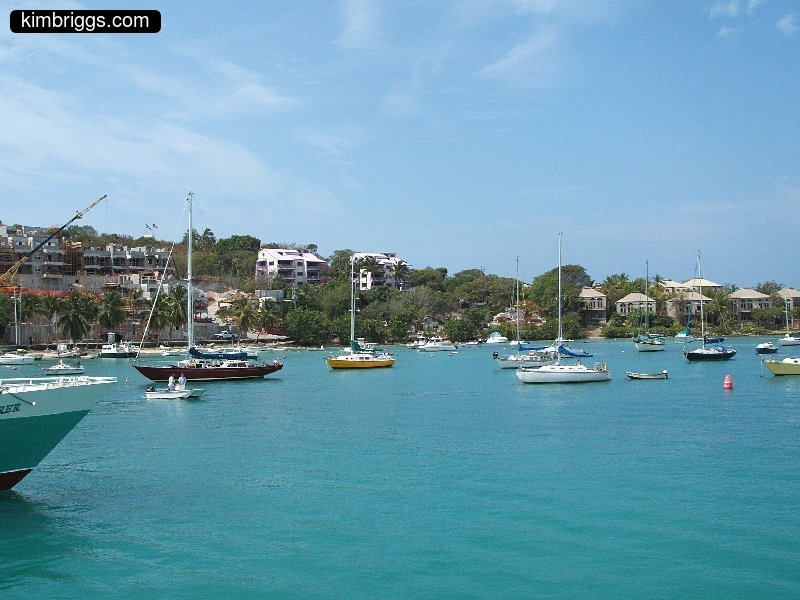 Small boats and condos at Caribbean bay.