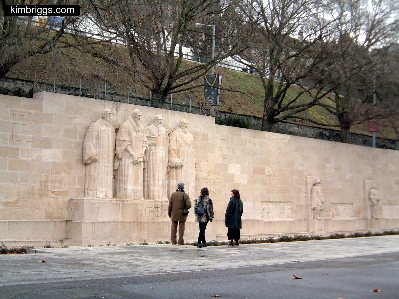 Sculptures of famous men in Geneva park.