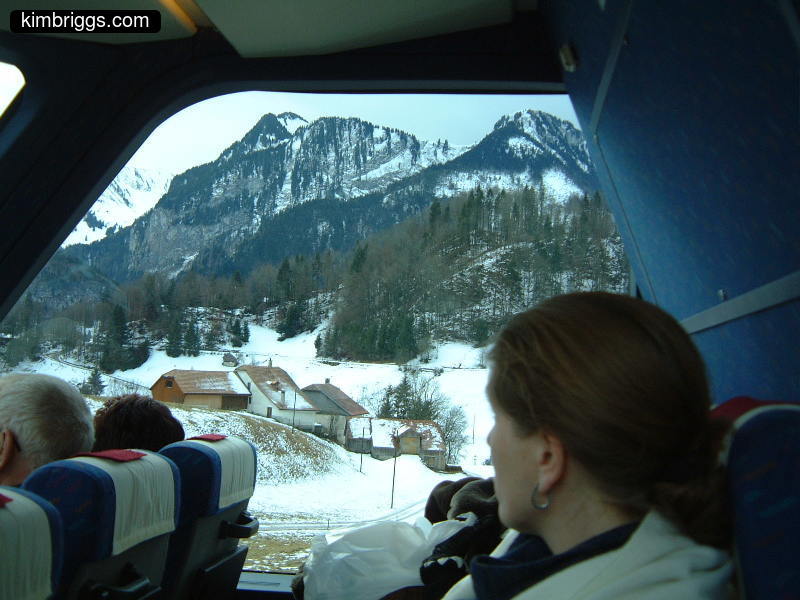 Woman looking out Golden Pass Train window.