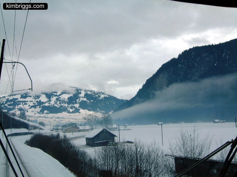 Snow mountains with clouds and fog.