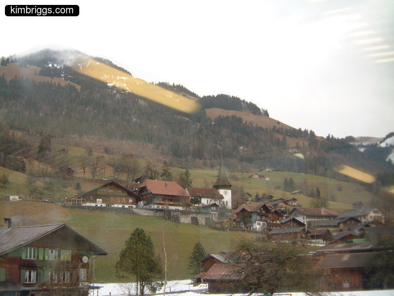 Church in small village on a hillside.