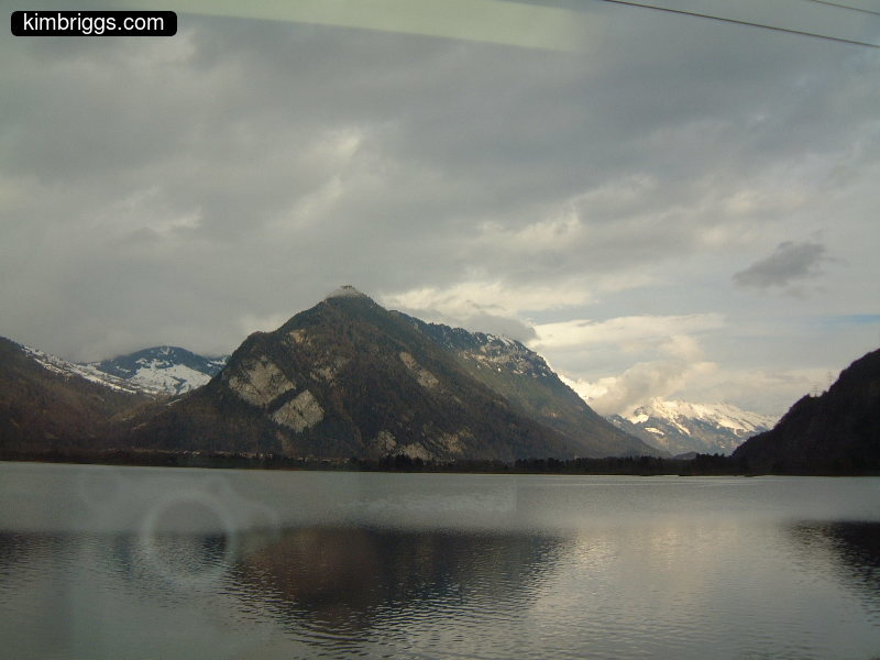 Switzerland mountains surrounding a lake.