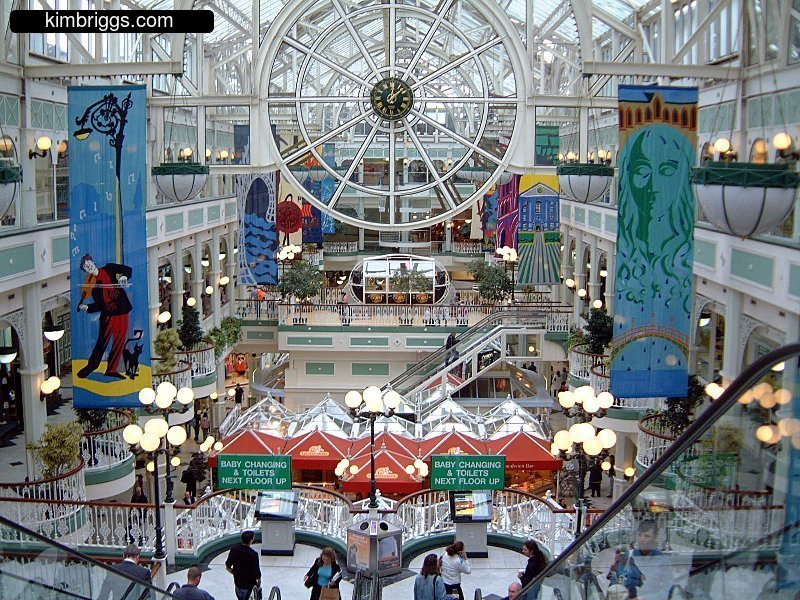 A modern shopping mall off with natural sunlight.