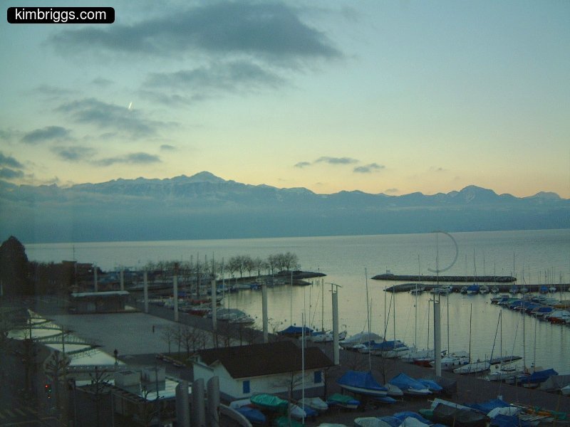Dusk on a lake marina in Ouchy, Switzerland.