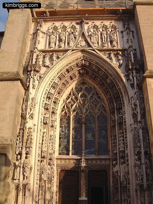 Huge ornate arch doorway in a church.