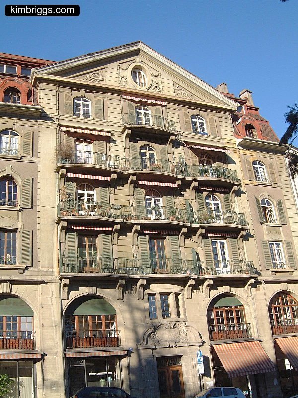 Stone city building with many porches.