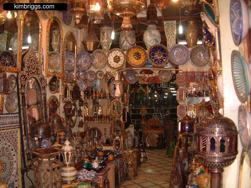Vendor stall filled with Moroccan souvenirs.