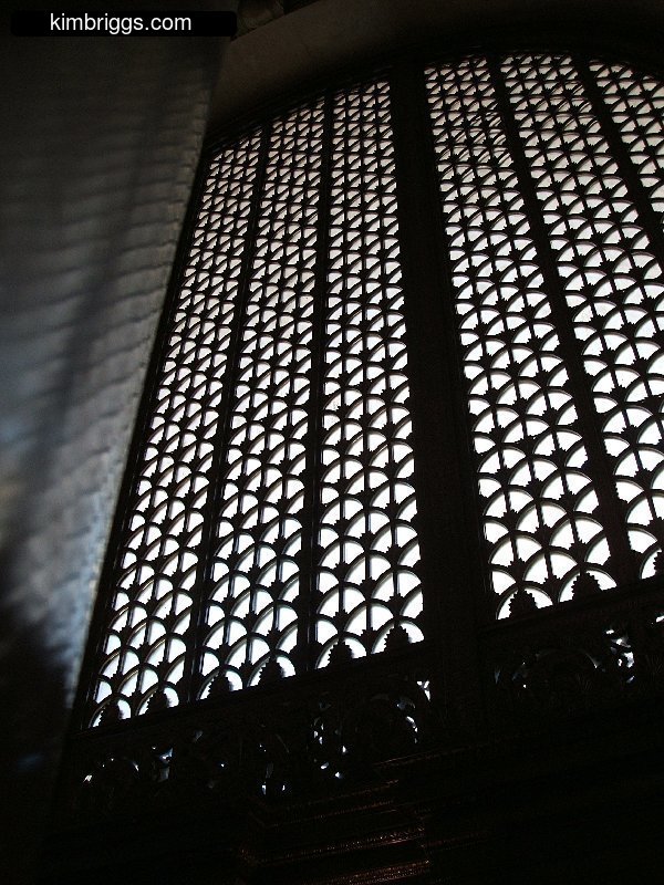 Huge window with artistic grill.