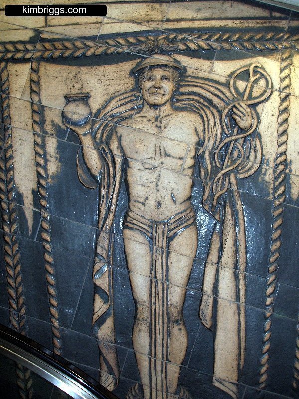 Wall Street subway tile art of Mercury, God of commerce.