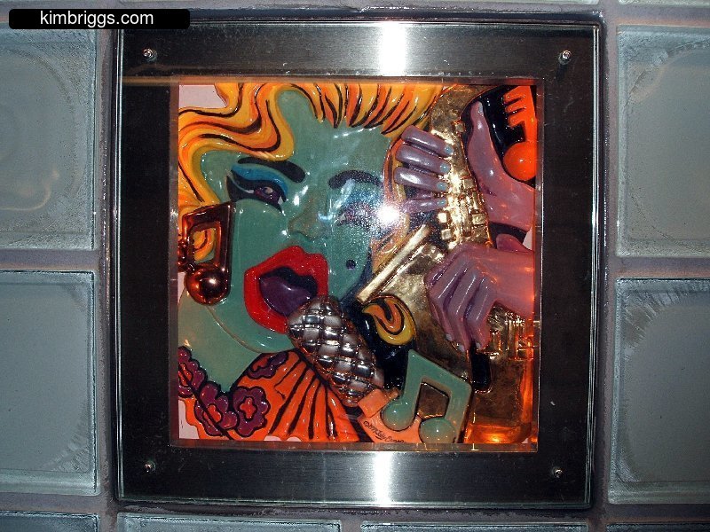 Colorful 3-D collage tile block.