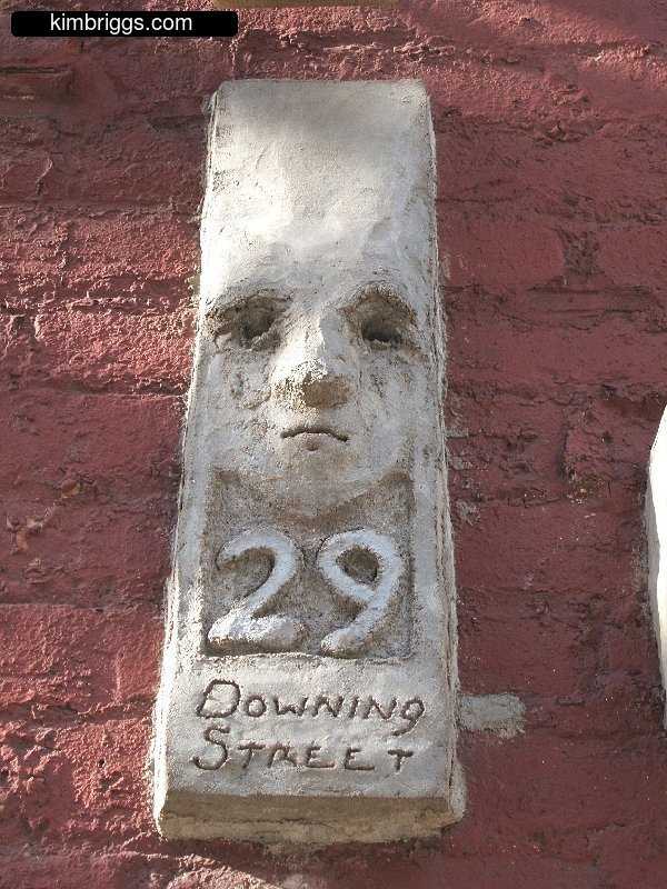 Creepy face in address label for 29 Downing Street.