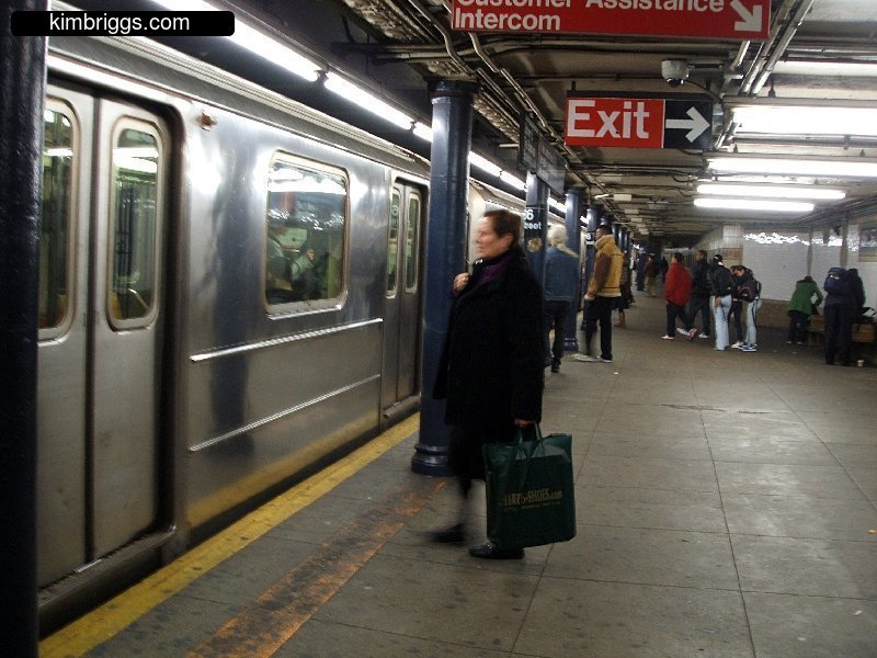 New York City subway train in underground station.