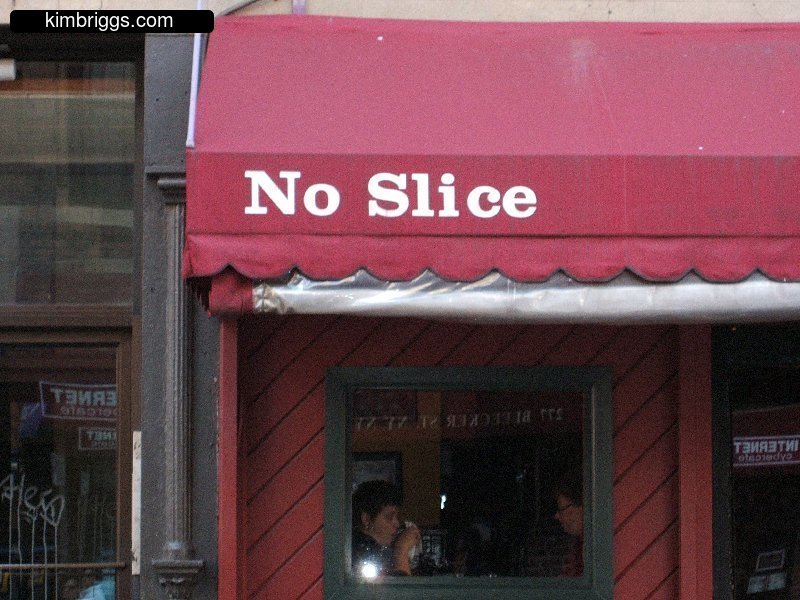 Sign on awning in Little Italy, "No Slice".