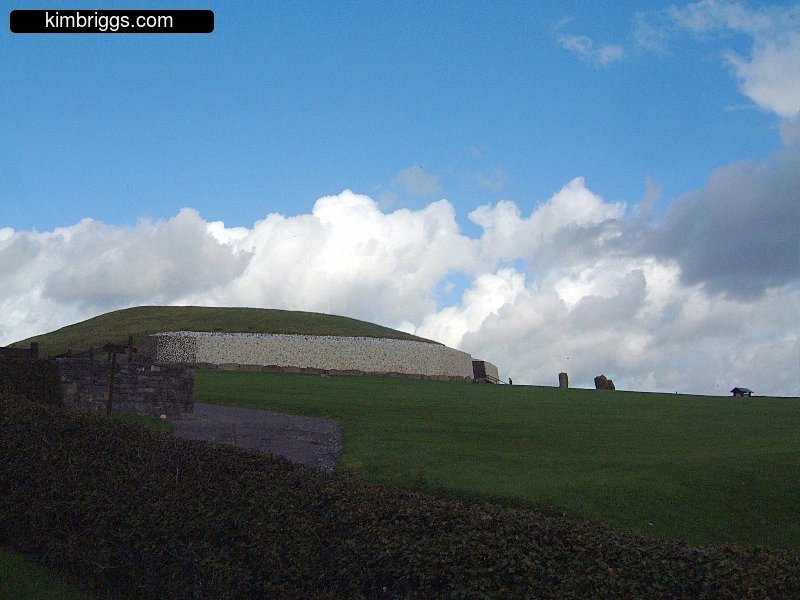 Newgrange profile with blue sky.