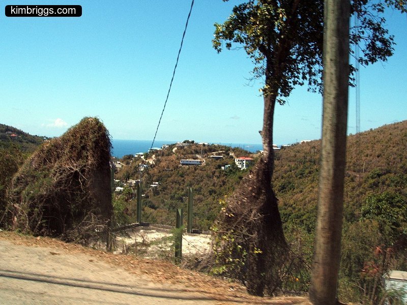 View of small buildings on Caribbean island hill.