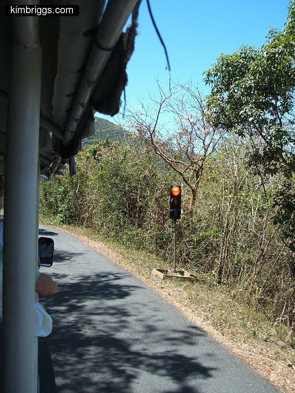 Temporary stop light on side of the road.