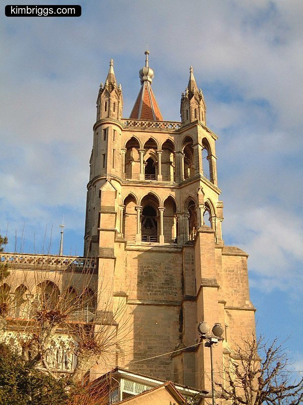 Fancy church tower with Gothic arches.