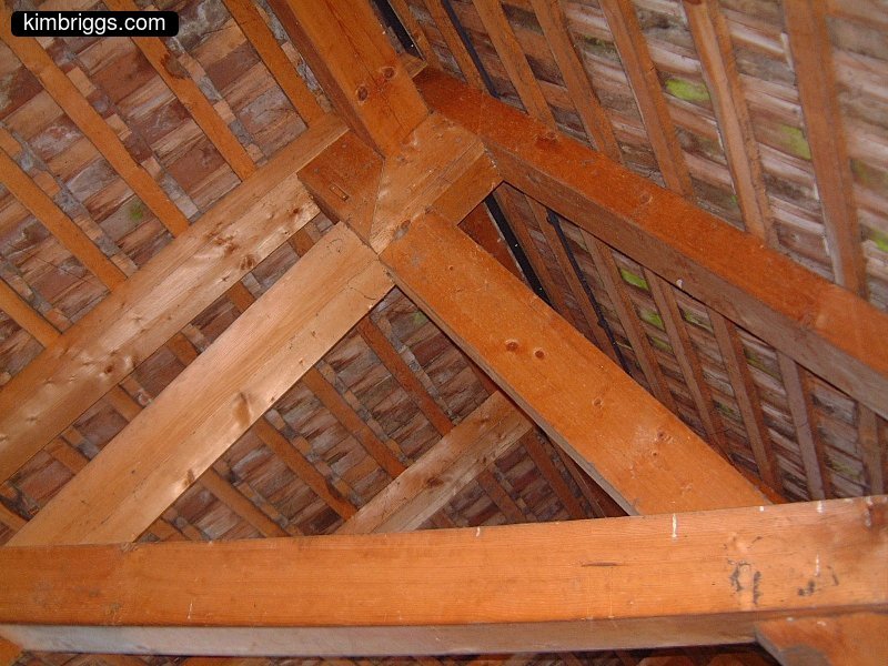Large wooden beams supporting roof.