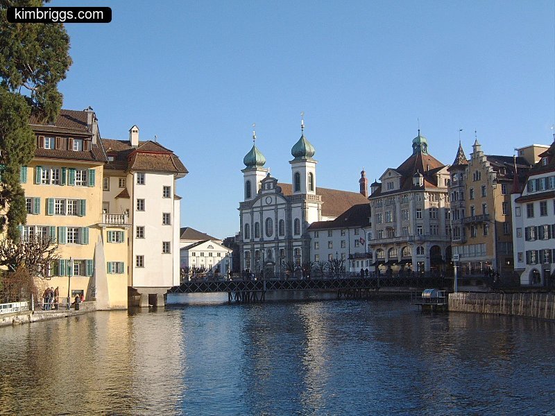 Onion-shaped turrets on building on a river.