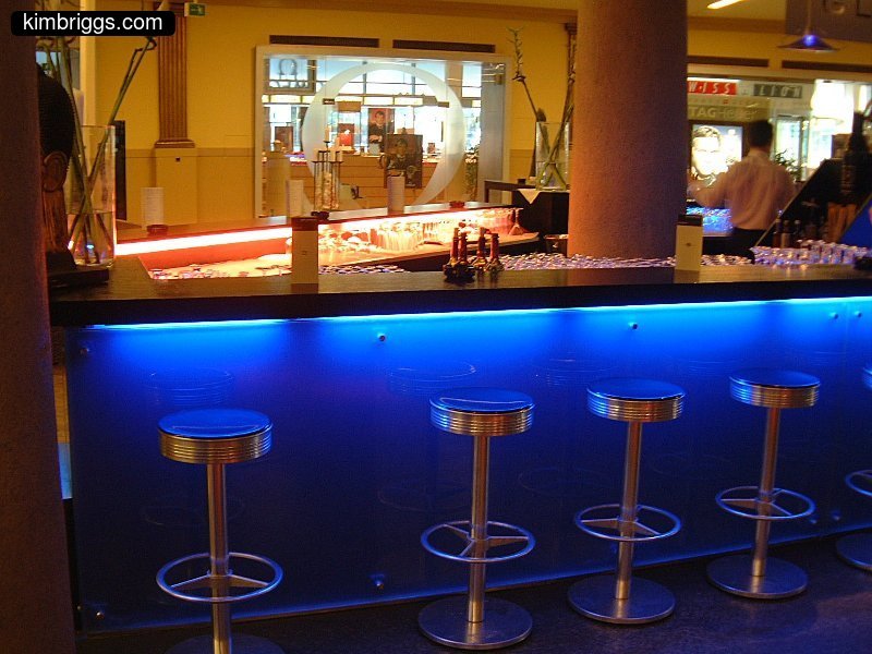 Modern bar with blue lights underneath.