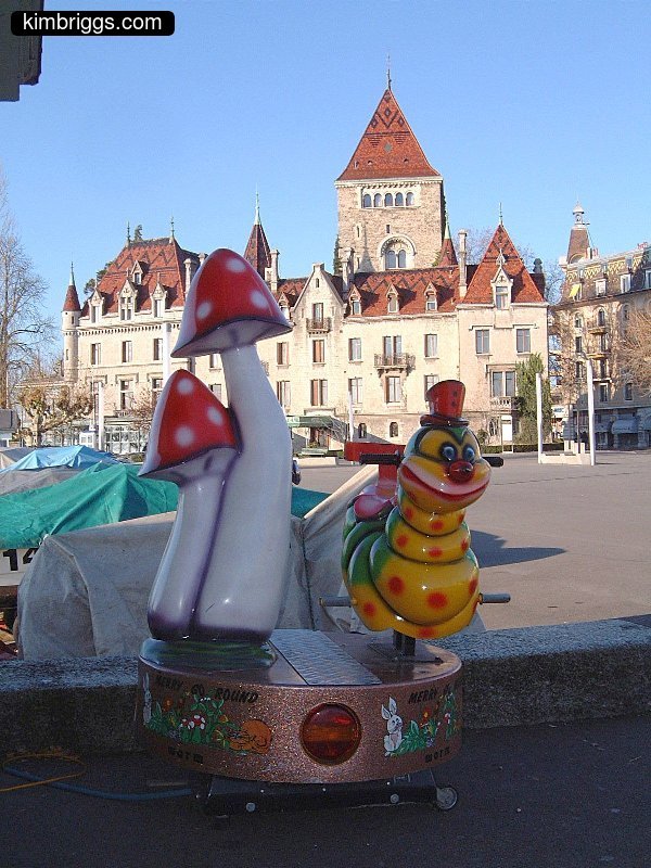 Child's ride with catepillar and mushrooms.
