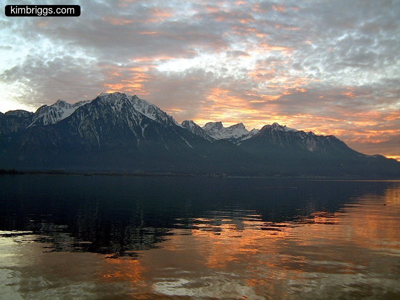 Very colorful sunet over the Alps and Lake Geneva.