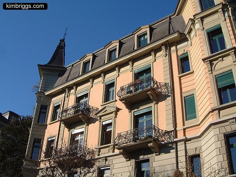 European apartment building with fancy metal railings.